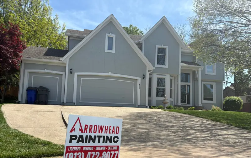 After: Two-story: tan to cool gray with white trim