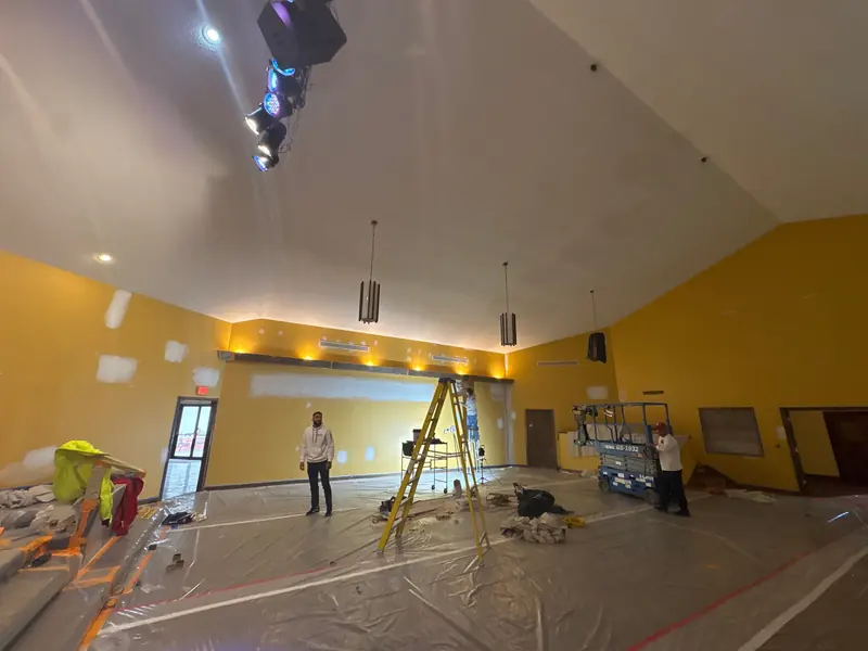 Arrowhead crew painting a church sanctuary