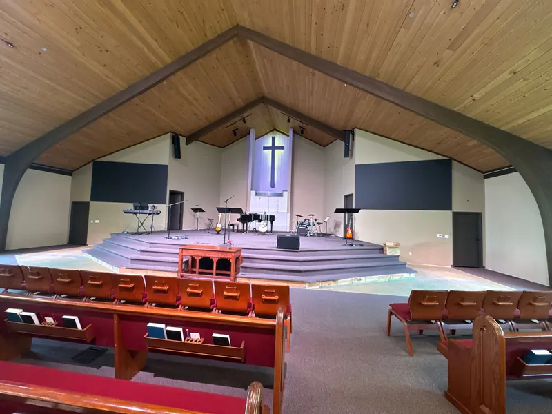 Church sanctuary repainted with charcoal accent panels
