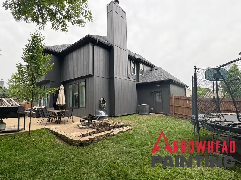 Home painted in a deep charcoal exterior color