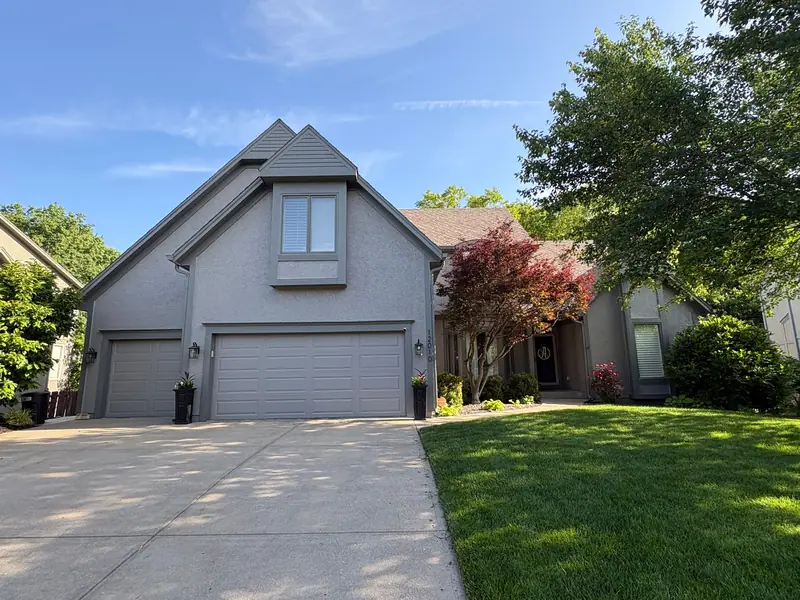 Gray two-story with steep gables
