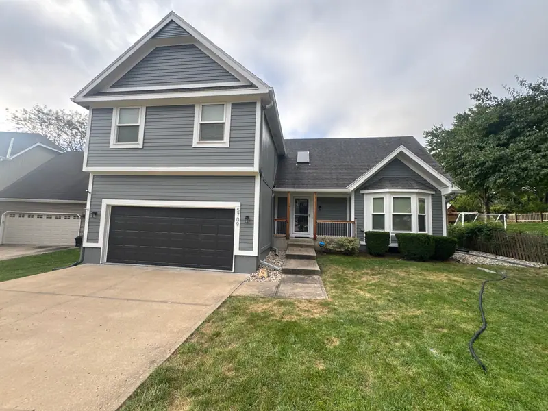 Classic gray two-story with white trim