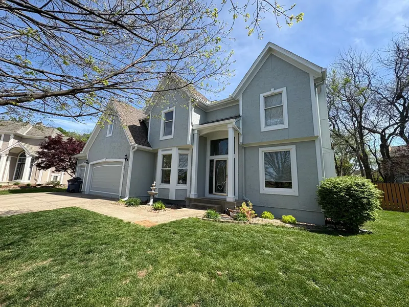 Gray-green two-story with white trim
