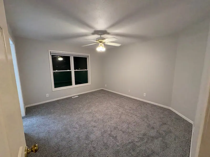 Bright, freshly painted bedroom