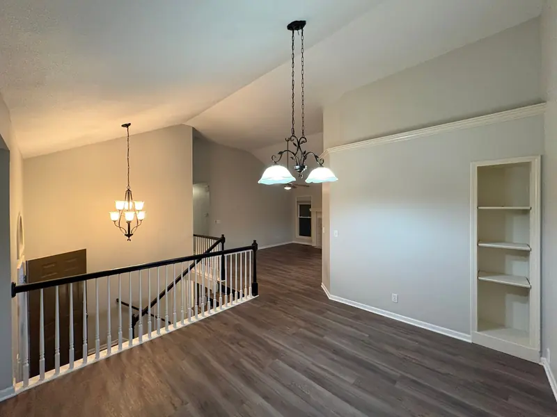 Dining area and stair landing in soft gray