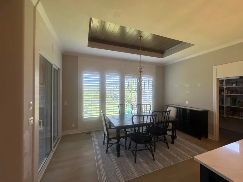 Dining room with a two-tone tray ceiling