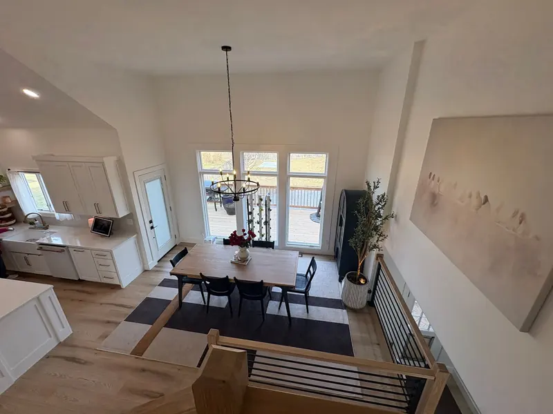 Bright white dining area with tall windows