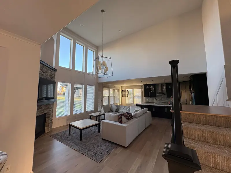 Two-story great room freshly painted in soft greige