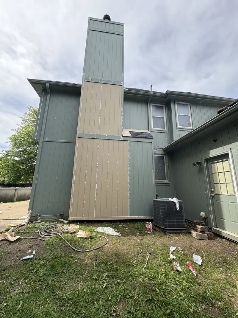 Chimney chase with new siding installed before paint