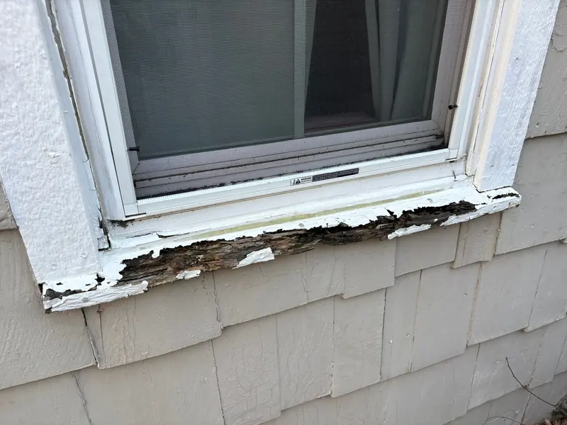 Rotted, peeling window sill